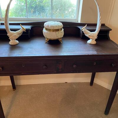 Antique black wooden writing desk with stenciling and cubbies