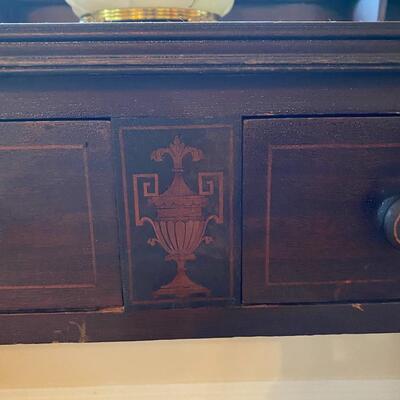 Antique black wooden writing desk with stenciling and cubbies