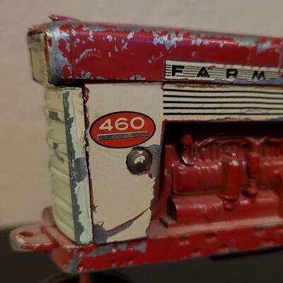 Lot 102: Vintage Cast Iron FARMALL 460 Toy Tractor