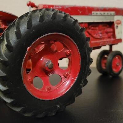 Lot 102: Vintage Cast Iron FARMALL 460 Toy Tractor