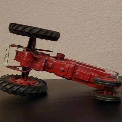 Lot 102: Vintage Cast Iron FARMALL 460 Toy Tractor