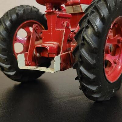 Lot 102: Vintage Cast Iron FARMALL 460 Toy Tractor