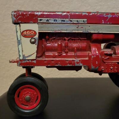 Lot 102: Vintage Cast Iron FARMALL 460 Toy Tractor