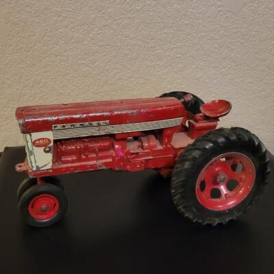 Lot 102: Vintage Cast Iron FARMALL 460 Toy Tractor