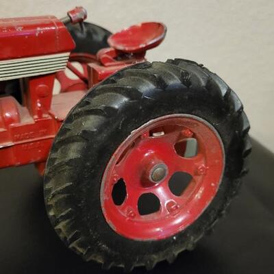 Lot 102: Vintage Cast Iron FARMALL 460 Toy Tractor