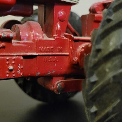 Lot 102: Vintage Cast Iron FARMALL 460 Toy Tractor