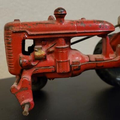 Lot 103: Vintage Diecast Iron Tractor with Nickel Plated Driver