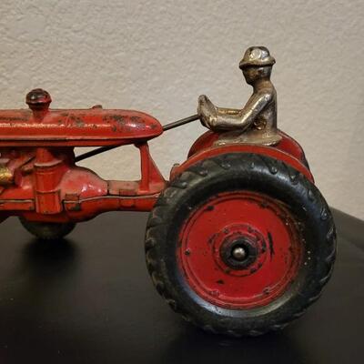 Lot 103: Vintage Diecast Iron Tractor with Nickel Plated Driver