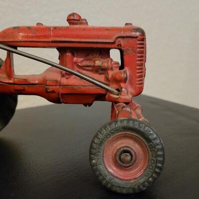 Lot 103: Vintage Diecast Iron Tractor with Nickel Plated Driver