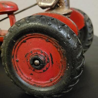 Lot 103: Vintage Diecast Iron Tractor with Nickel Plated Driver