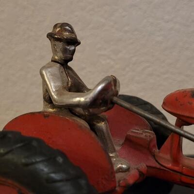 Lot 103: Vintage Diecast Iron Tractor with Nickel Plated Driver