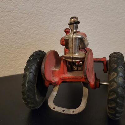 Lot 103: Vintage Diecast Iron Tractor with Nickel Plated Driver