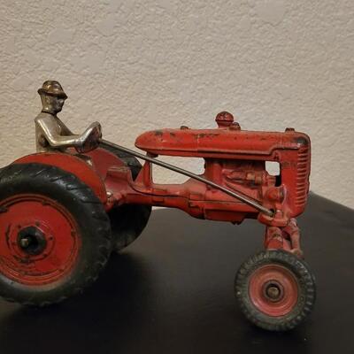 Lot 103: Vintage Diecast Iron Tractor with Nickel Plated Driver
