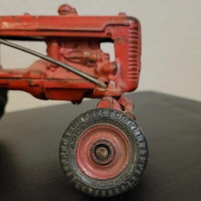 Lot 103: Vintage Diecast Iron Tractor with Nickel Plated Driver