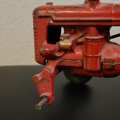 Lot 103: Vintage Diecast Iron Tractor with Nickel Plated Driver