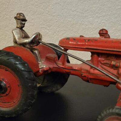 Lot 103: Vintage Diecast Iron Tractor with Nickel Plated Driver