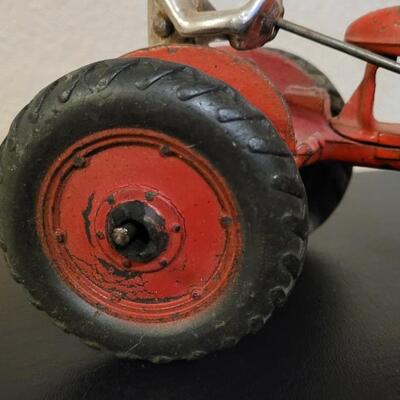 Lot 103: Vintage Diecast Iron Tractor with Nickel Plated Driver