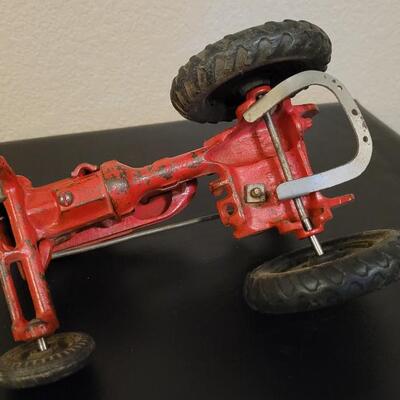 Lot 103: Vintage Diecast Iron Tractor with Nickel Plated Driver