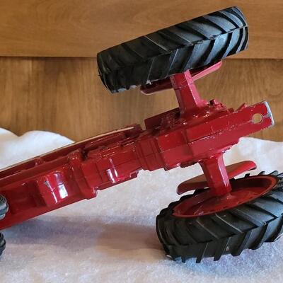 Lot 105: Vintage Cast Iron Farmall Red Tractor