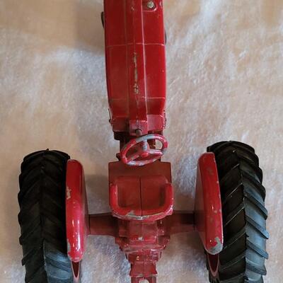 Lot 105: Vintage Cast Iron Farmall Red Tractor