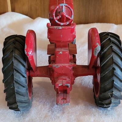 Lot 105: Vintage Cast Iron Farmall Red Tractor