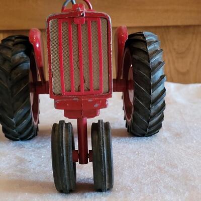 Lot 105: Vintage Cast Iron Farmall Red Tractor