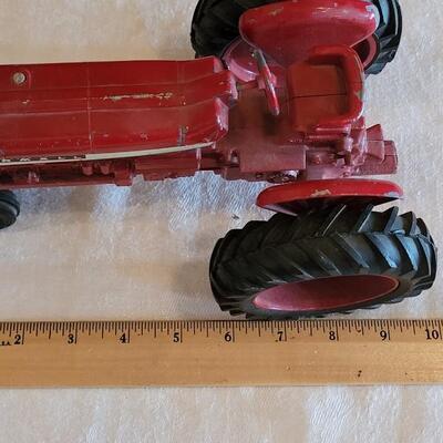 Lot 105: Vintage Cast Iron Farmall Red Tractor