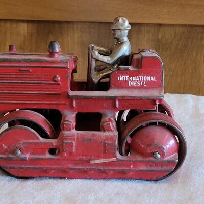 Lot 106: Antique International Diesel Cast Iron Trac Tractor with Nickel Plated Driver