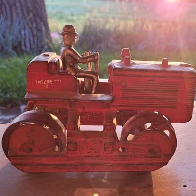 Lot 106: Antique International Diesel Cast Iron Trac Tractor with Nickel Plated Driver