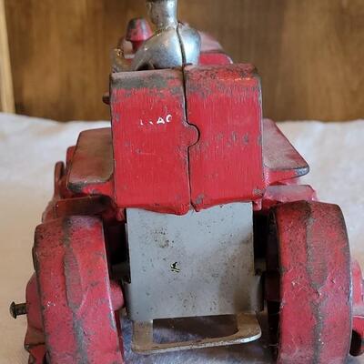 Lot 106: Antique International Diesel Cast Iron Trac Tractor with Nickel Plated Driver
