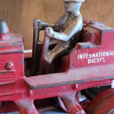 Lot 106: Antique International Diesel Cast Iron Trac Tractor with Nickel Plated Driver