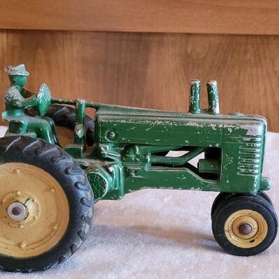 Lot 108: Vintage John Deer Cast Iron Tractor with Green Cast Iron Driver