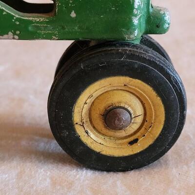 Lot 108: Vintage John Deer Cast Iron Tractor with Green Cast Iron Driver