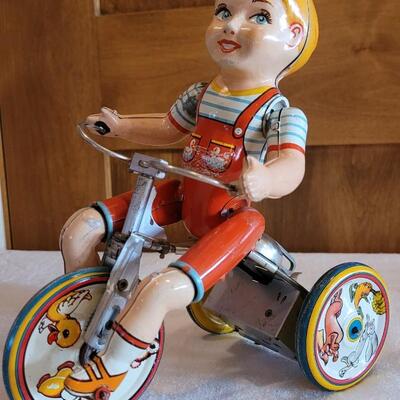 Lot 132: 1930's Kiddy Cyclist Wind Up Tin Toy by Unique Art Mfg. Co. (works)