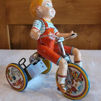 Lot 132: 1930's Kiddy Cyclist Wind Up Tin Toy by Unique Art Mfg. Co. (works)