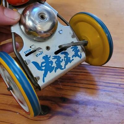 Lot 132: 1930's Kiddy Cyclist Wind Up Tin Toy by Unique Art Mfg. Co. (works)