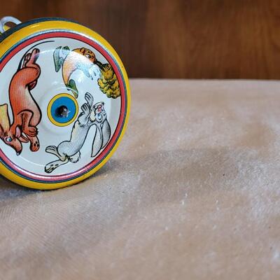 Lot 132: 1930's Kiddy Cyclist Wind Up Tin Toy by Unique Art Mfg. Co. (works)