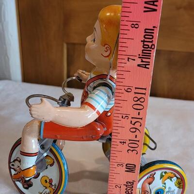 Lot 132: 1930's Kiddy Cyclist Wind Up Tin Toy by Unique Art Mfg. Co. (works)