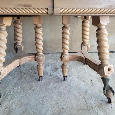 Lot 142: Vintage Claw Foot Dining Table w/ Wood Coaster Wheels includes Multiple Leaves