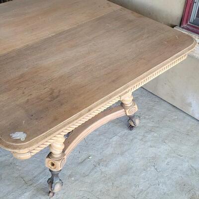 Lot 142: Vintage Claw Foot Dining Table w/ Wood Coaster Wheels includes Multiple Leaves