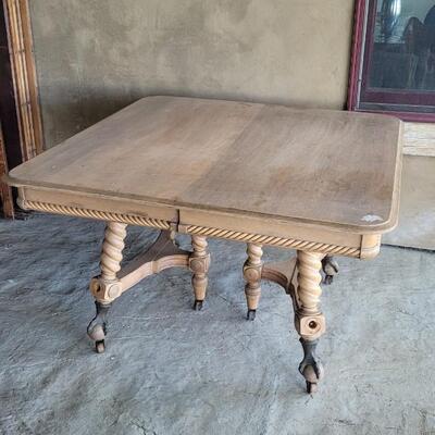 Lot 142: Vintage Claw Foot Dining Table w/ Wood Coaster Wheels includes Multiple Leaves
