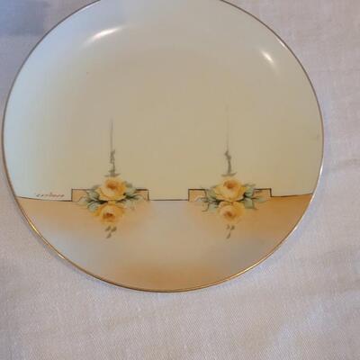 Lot 159: Hand Painted Rose Dishes marked pieces Prussia, Germany, Nippon and Everett