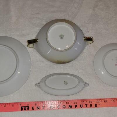 Lot 159: Hand Painted Rose Dishes marked pieces Prussia, Germany, Nippon and Everett