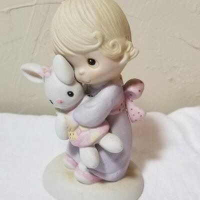 Lot 211: Precious Moments "God Understands" and "Jesus Loves Me"