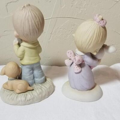 Lot 211: Precious Moments "God Understands" and "Jesus Loves Me"