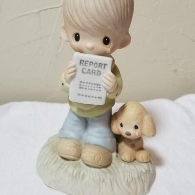 Lot 211: Precious Moments "God Understands" and "Jesus Loves Me"