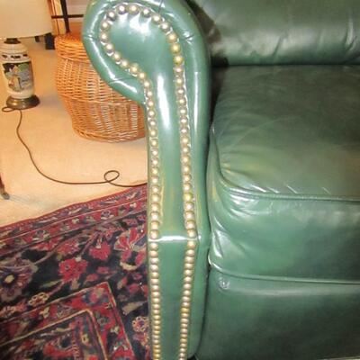 LOT 54 WING BACK GREEN LEATHER RECLINER 