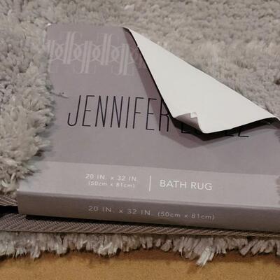 Lot 295: (2) Jennifer Lopez 20" Ã— 32" Light Gray Rugs 