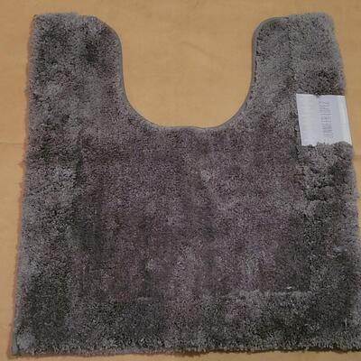 Lot 298: Jennifer Lopez Dark Gray Bathroom Contour Rug and 17" Ã— 24" Rug