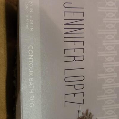 Lot 298: Jennifer Lopez Dark Gray Bathroom Contour Rug and 17" Ã— 24" Rug